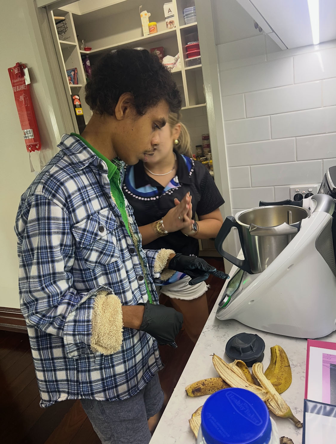 Resident of NWSIL learning to cook