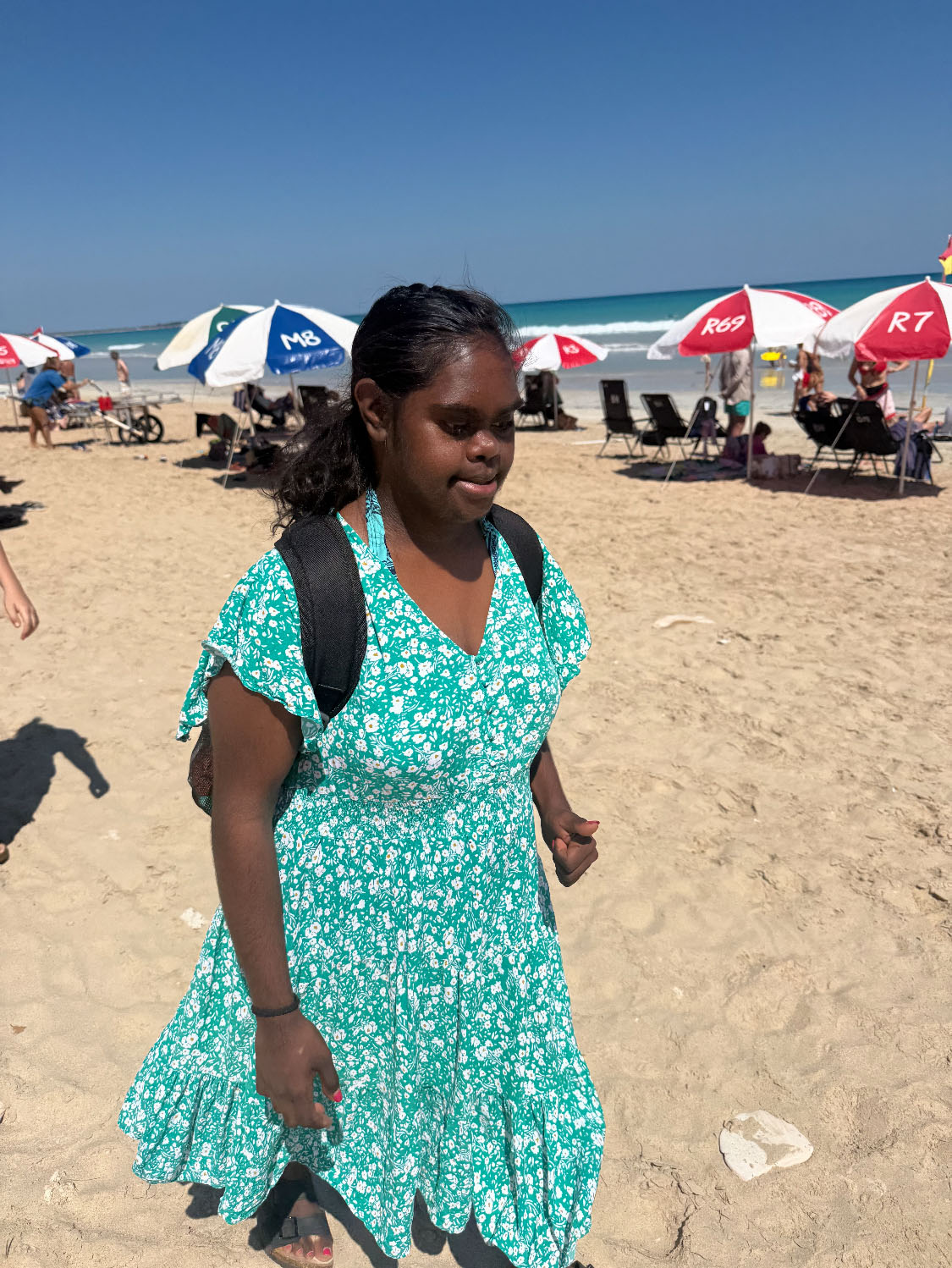 Resident of NWSIL walking along Cable Beach